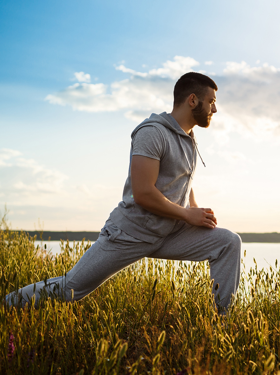 Confident adult man in a calm, sunlit morning wellness routine